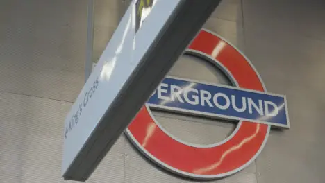 Station Sign And Logo For King's Cross Underground Tube Station London UK