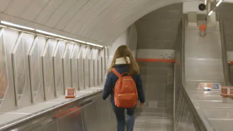 Commuter Passengers On Escalators At Underground Station In London UK