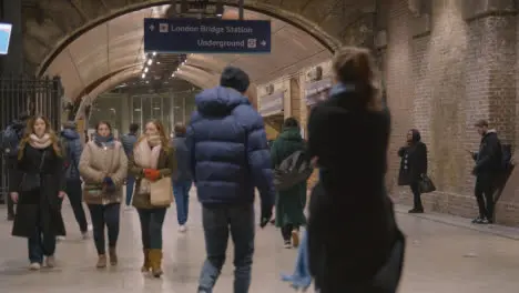 Busy Entrance To London Bridge Rail Station London UK With Commuters At Night 1