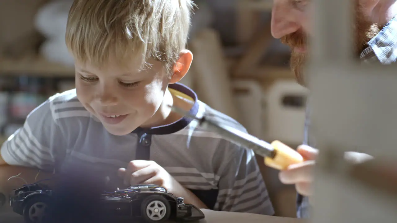 Child Builds An Electric Car In The Craft Workshop