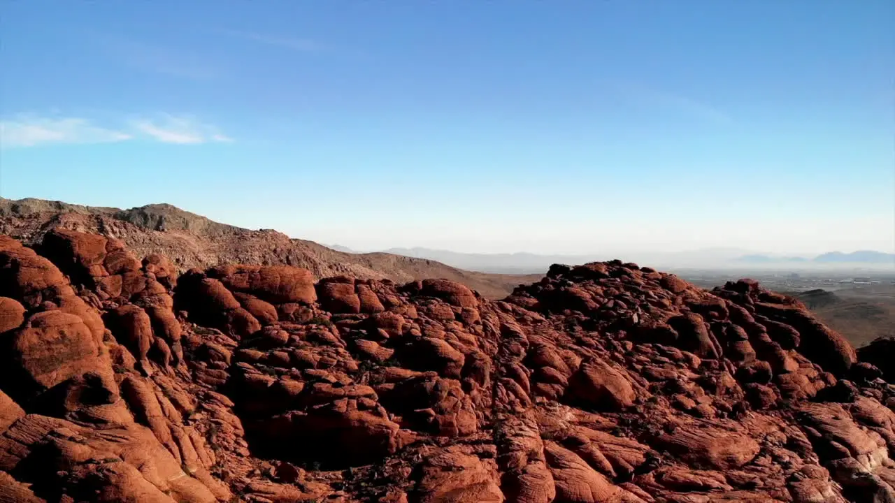 Rising drone shot of sandstone mountains at Red Rock Canyon Park in Nevada