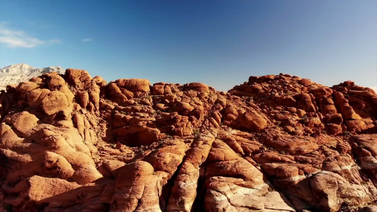 Climbing drone footage of red sandstone mountains at Red Rock Canyon Park near Las Vegas