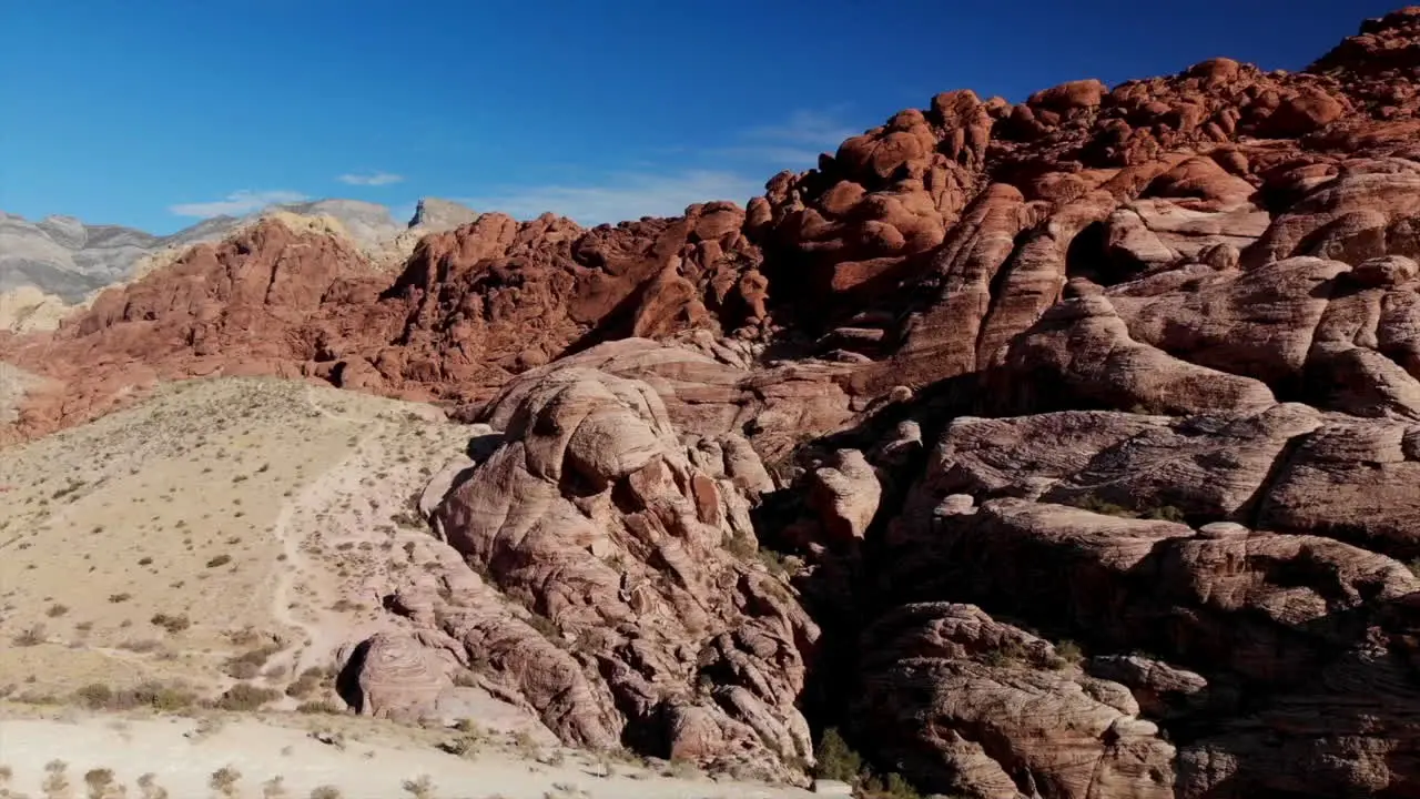 Bird's eye view of red sandstone mountains from drone Red Rock Canyon Park near Las Vegas Nevada