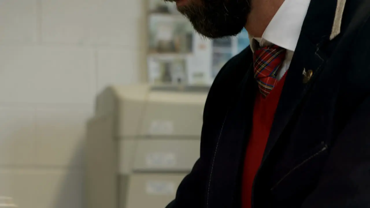 Businessman using laptop at desk 4k