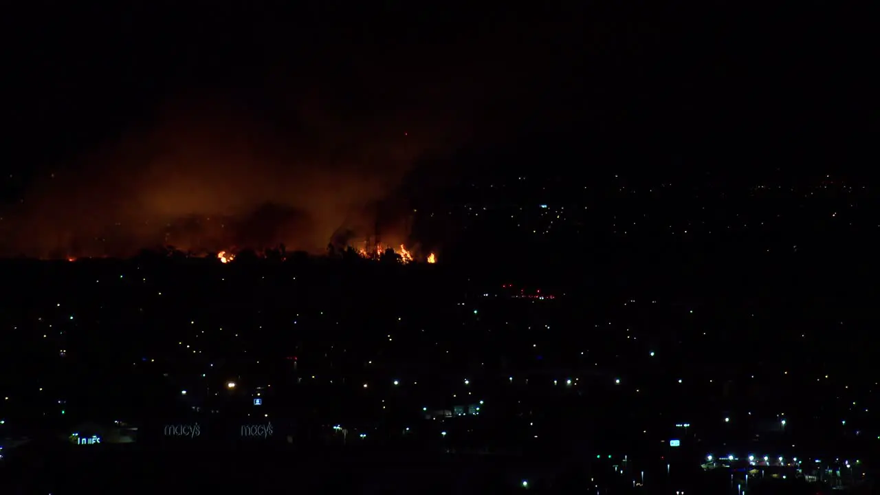 A Large Raging Fire Burns At Night In An Urban City Area