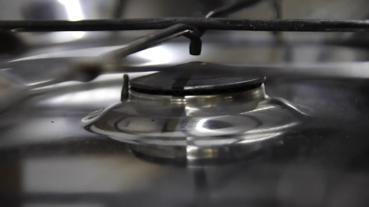 Closeup of turning off an old motorhome gas cooker