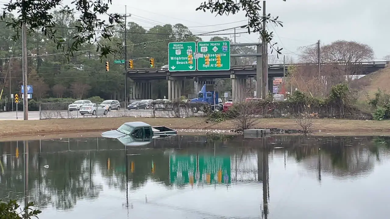 Truck crashed into pond right off a busy highway