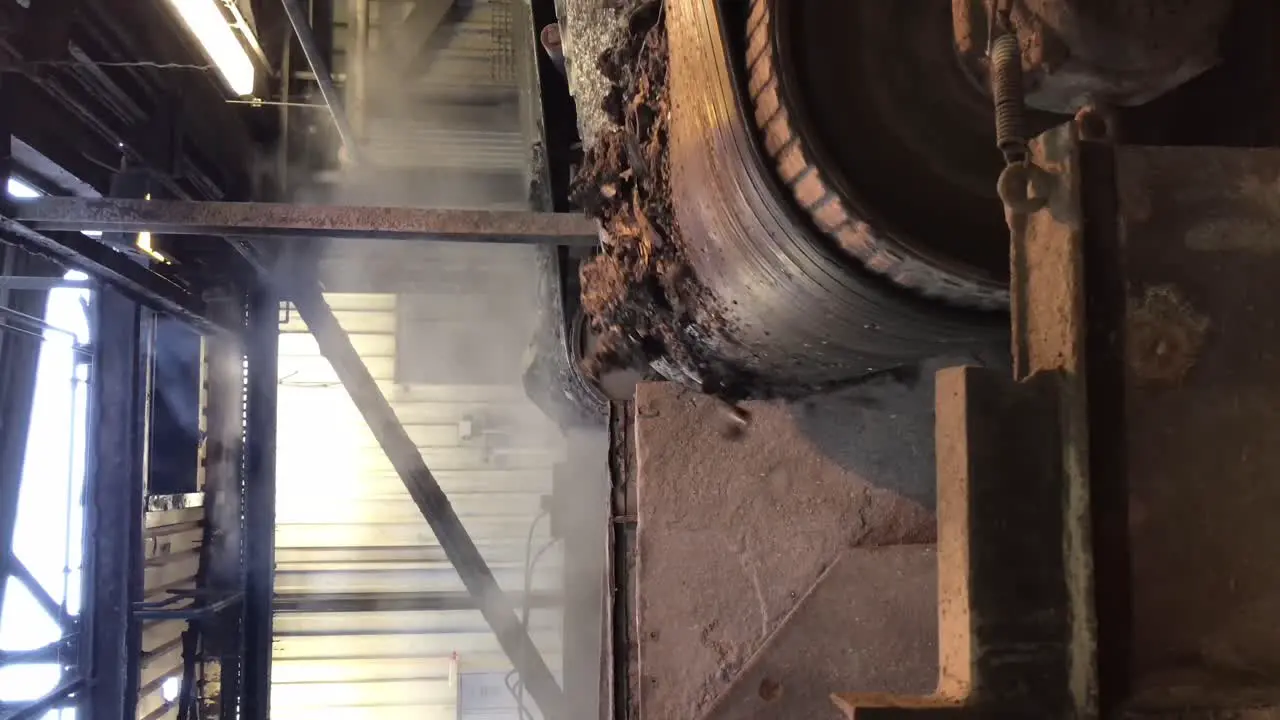 Two conveyor belts with incinerated waste VERTICAL footage