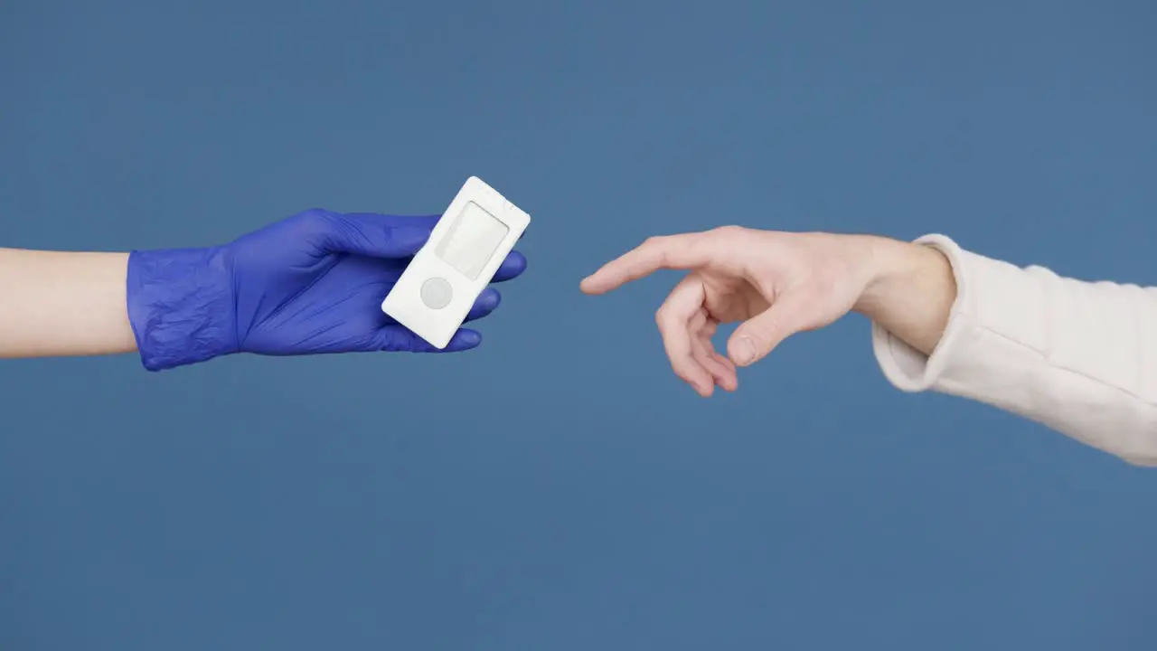 Hands make gesture holding monitoring medical gadget