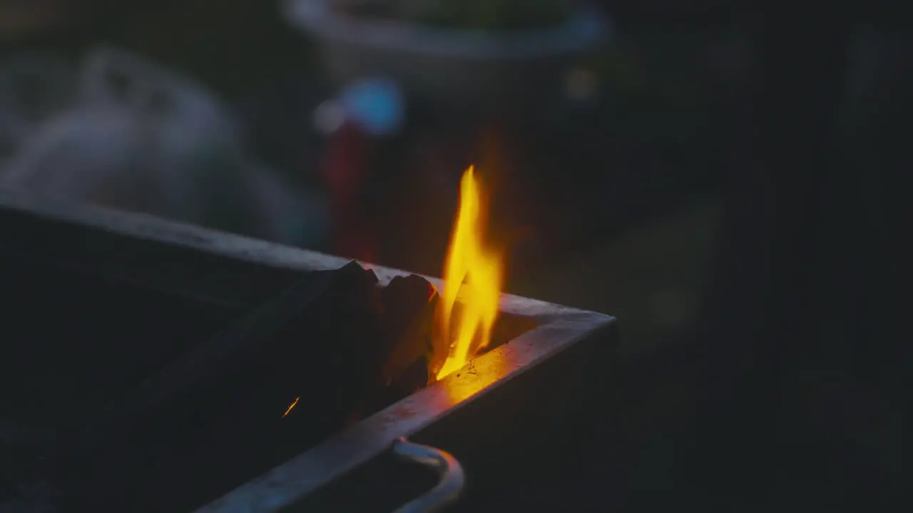 Vibrant coal fire burning with mesmerizing flames in the BBQ