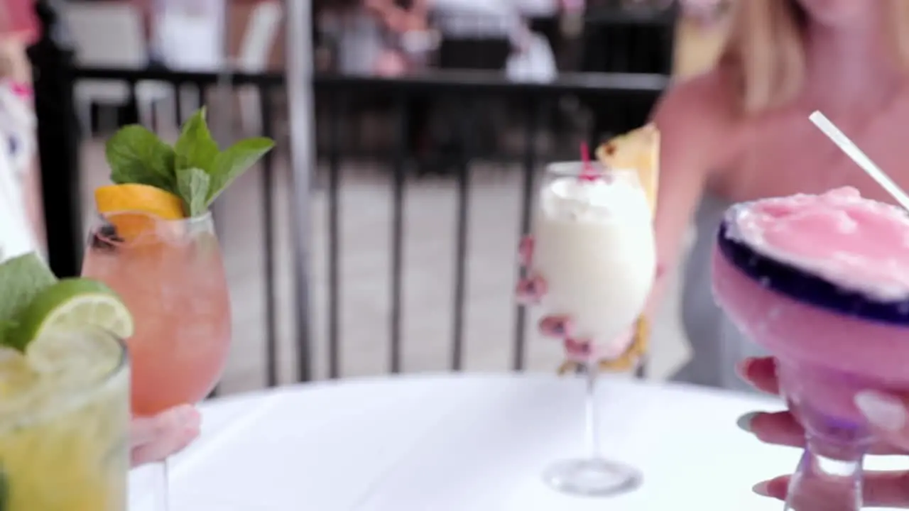 Group Of Friends Toasting Tropical Drinks