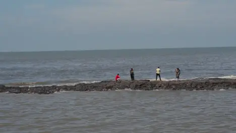 Close Up Of Bandra Fort In Mumbai India With People Fishing