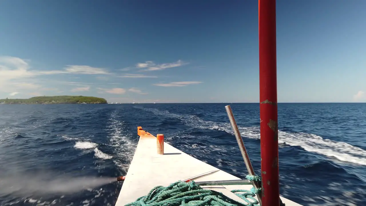 Rear passenger view on travel boat leaving island