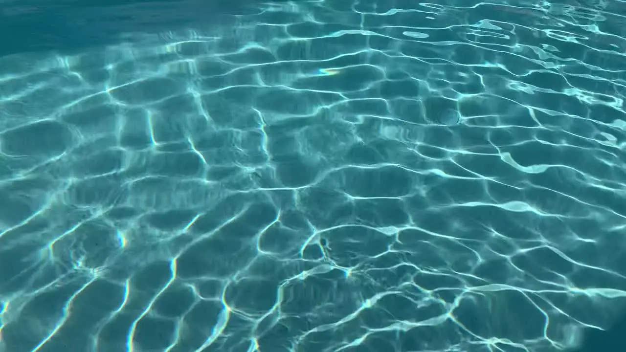 Swimming pool water patterns with reflections from sunlight