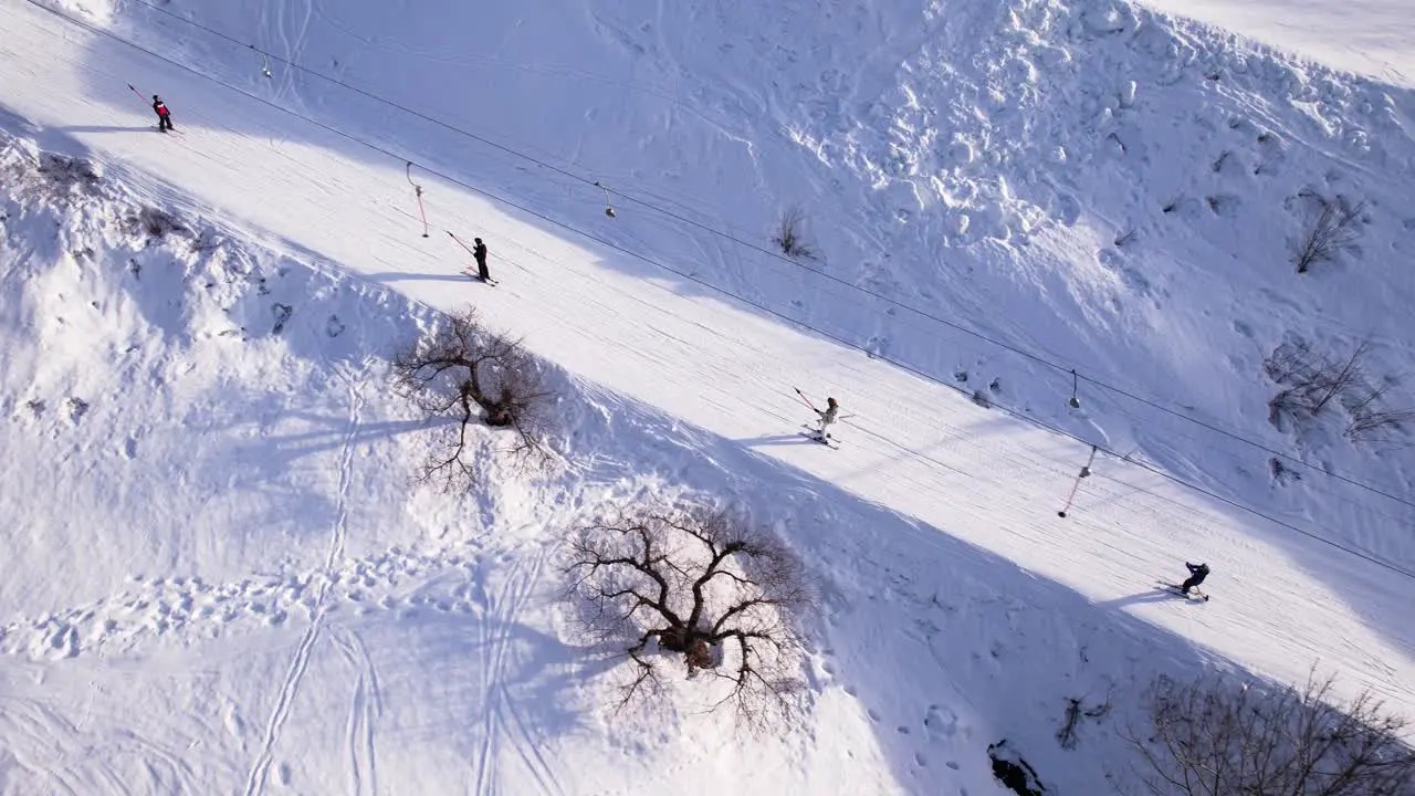 Skiers on platter lift in Norway