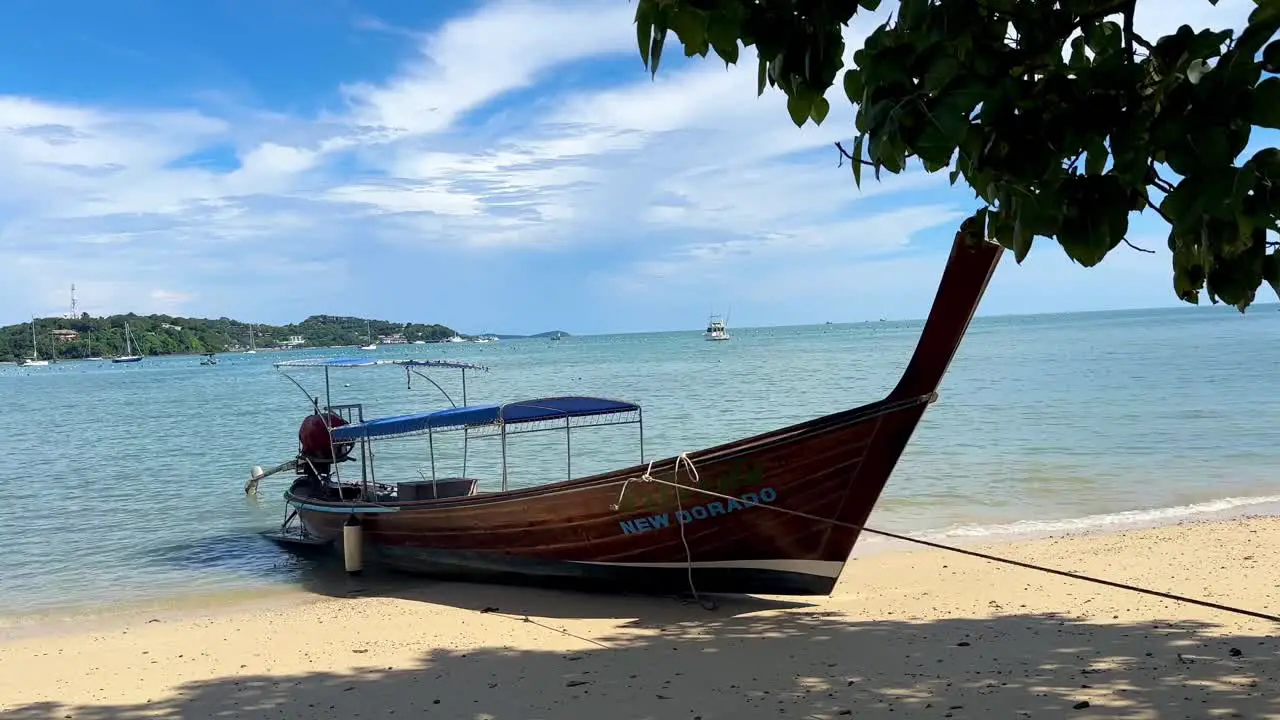 Stationary long tail boat on a sunny day in Phuket Thailand