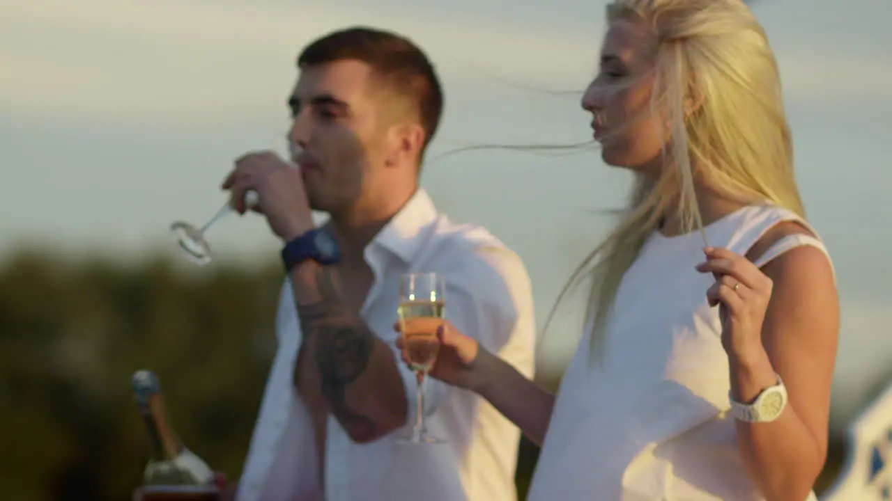 Couple drinking champagne on boat