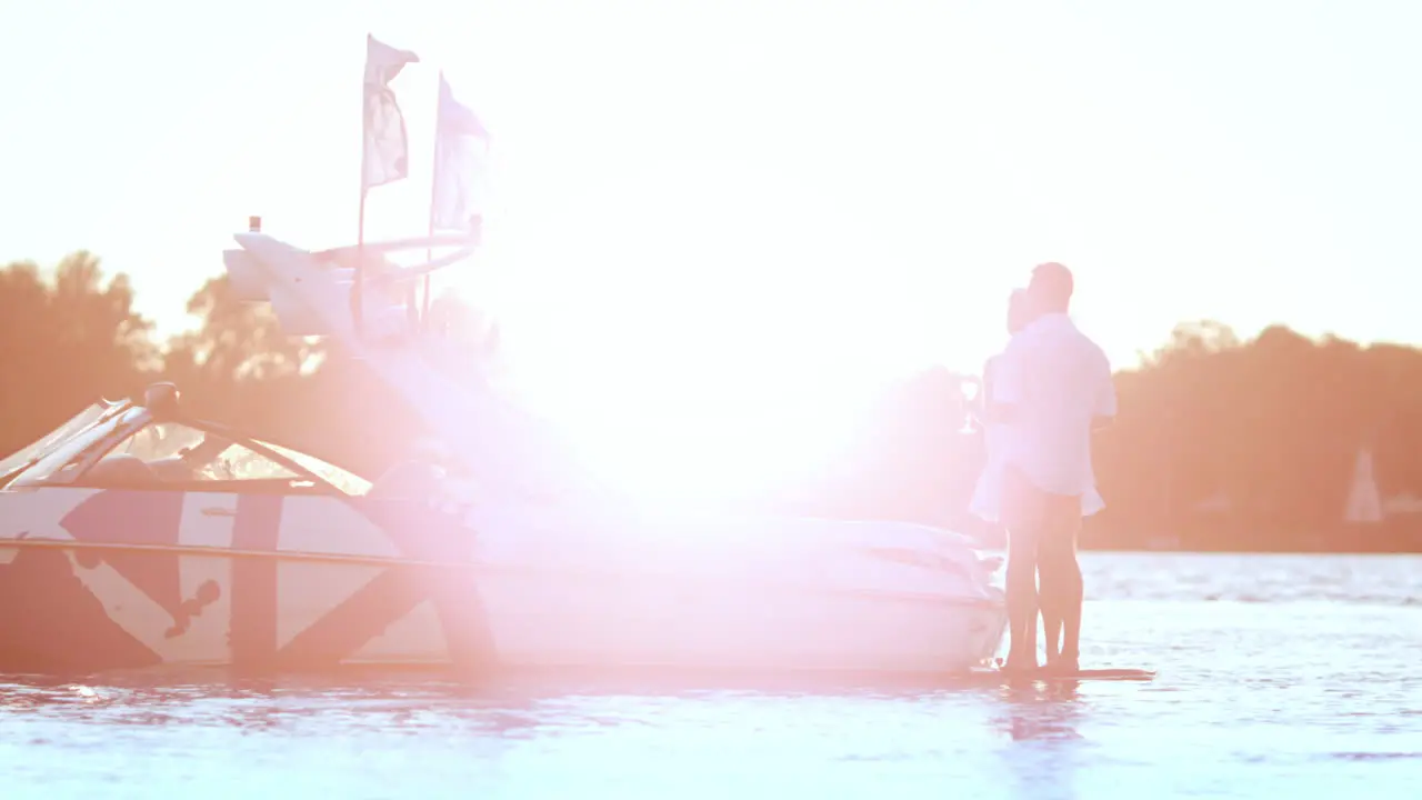 Happy couple relaxing together on yacht