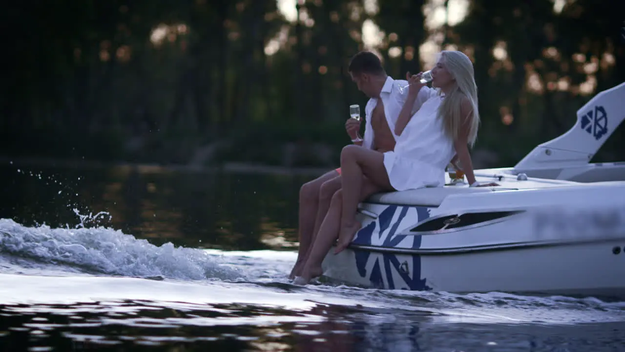 Lovely charming couple relaxing on floating boat