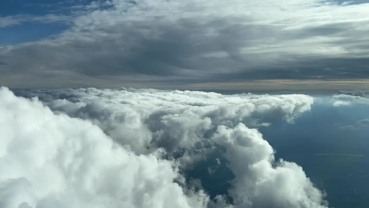 Cockpit view of spring cumulus clouds in the afternoon light