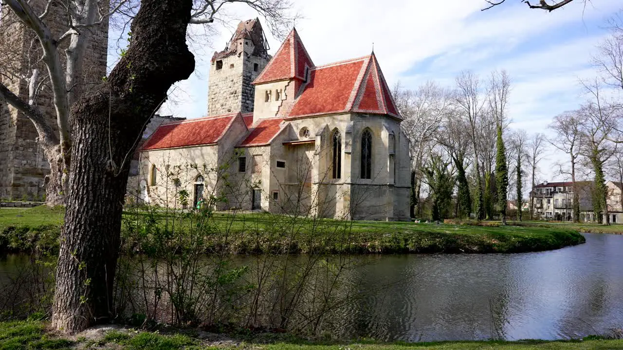 castle ruins with small moat in spring