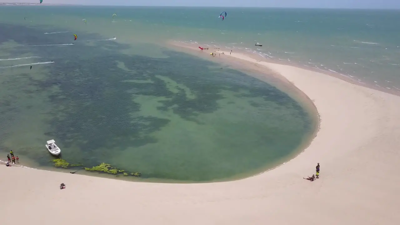 Drone footage of two people on the beach watching kitesurfers in Dakhla Morocco