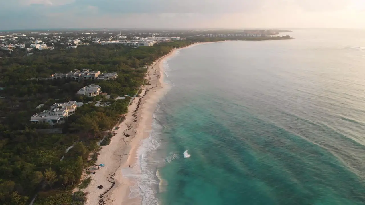 Playa del Carmen sandy beach with tropical sea on the coast of Mexico aerial cinematic view