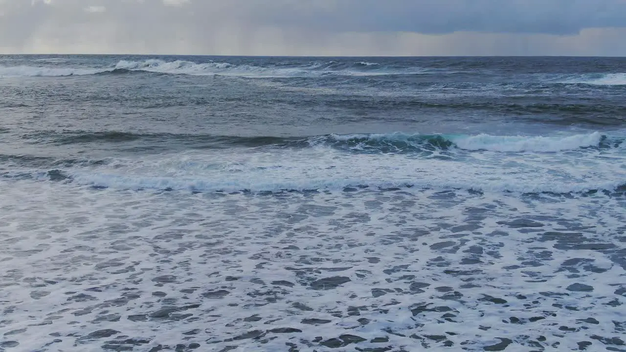 Slow motion aerial view of the North Sea waves