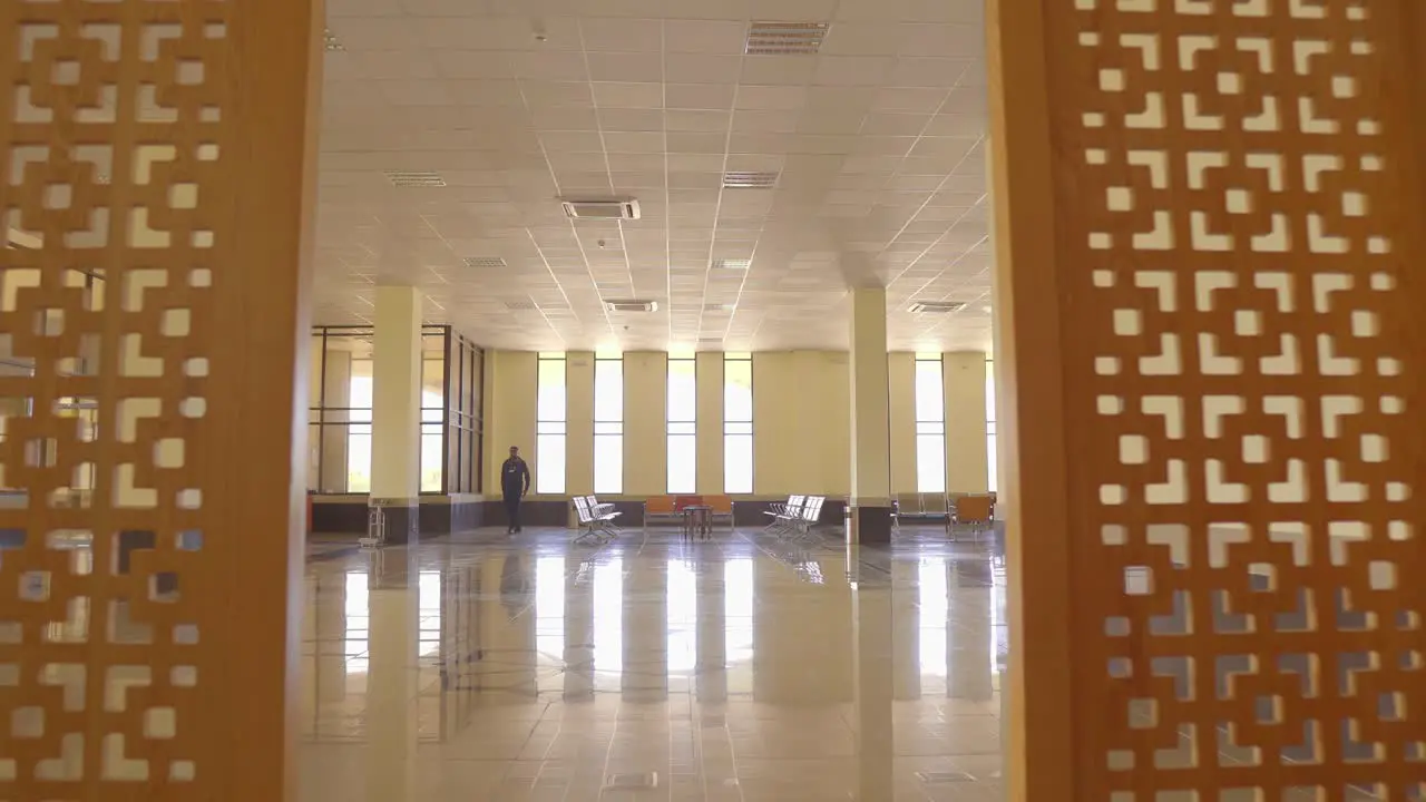 POV Walking Past Room Dividers Into Empty Airport Lounge With Mai Bakhtawar Airport