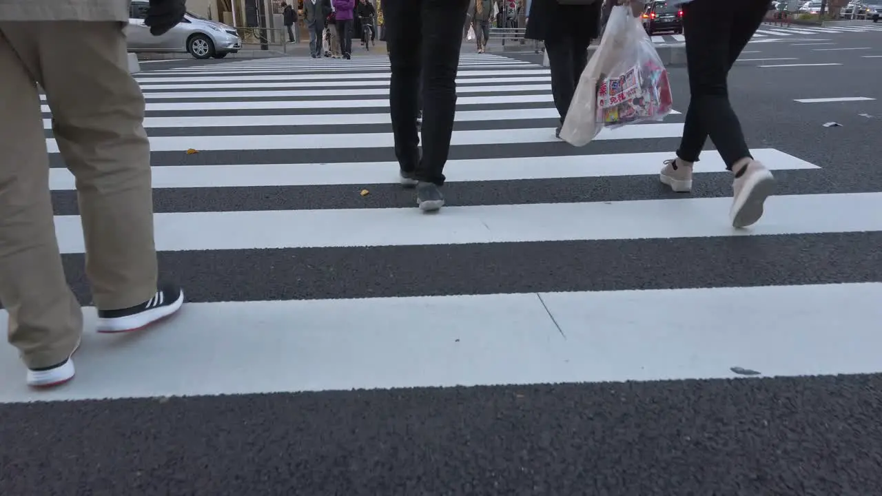 4k HD video while walking cross the street over zebra line in Tokyo