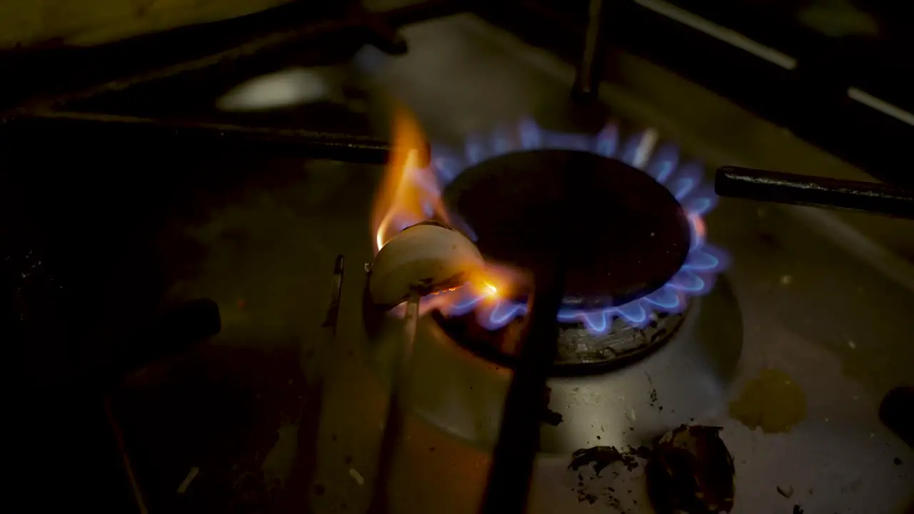 Heating Roasting Garlic Clove On Gas Stove