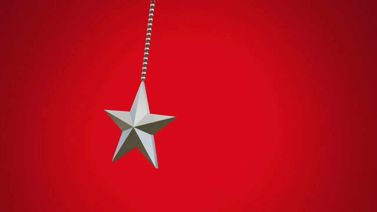 Animation of hanging star swinging against red background