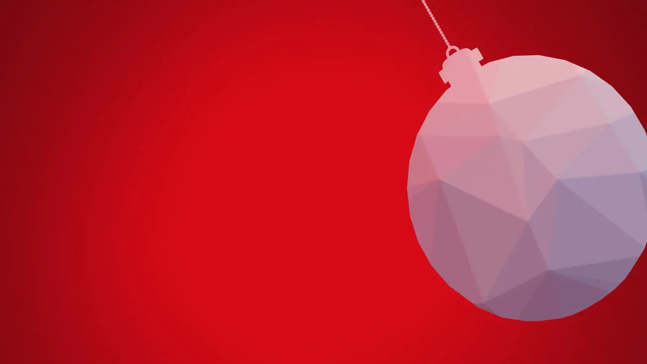 Animation of close up of hanging bauble swinging against red background