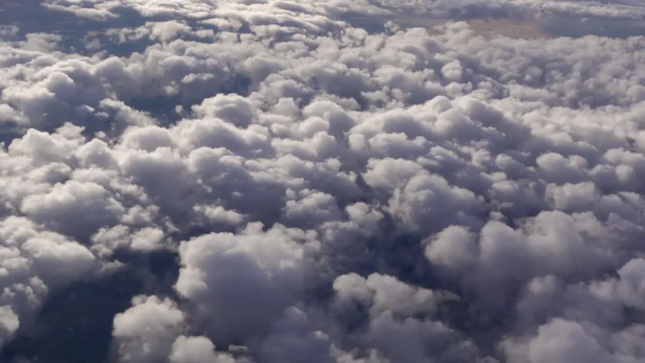 A Carpet of Fluffy Clouds through an Airplane Window