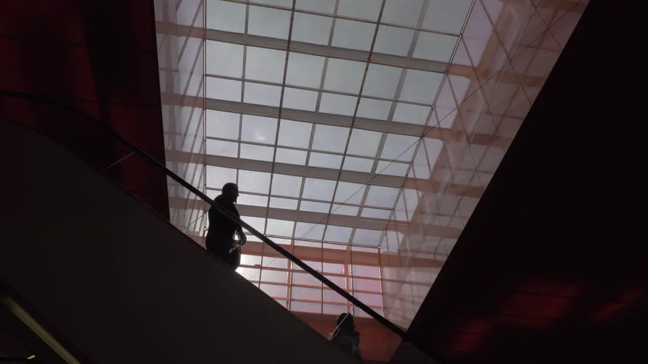 Escalator with people in shopping mall