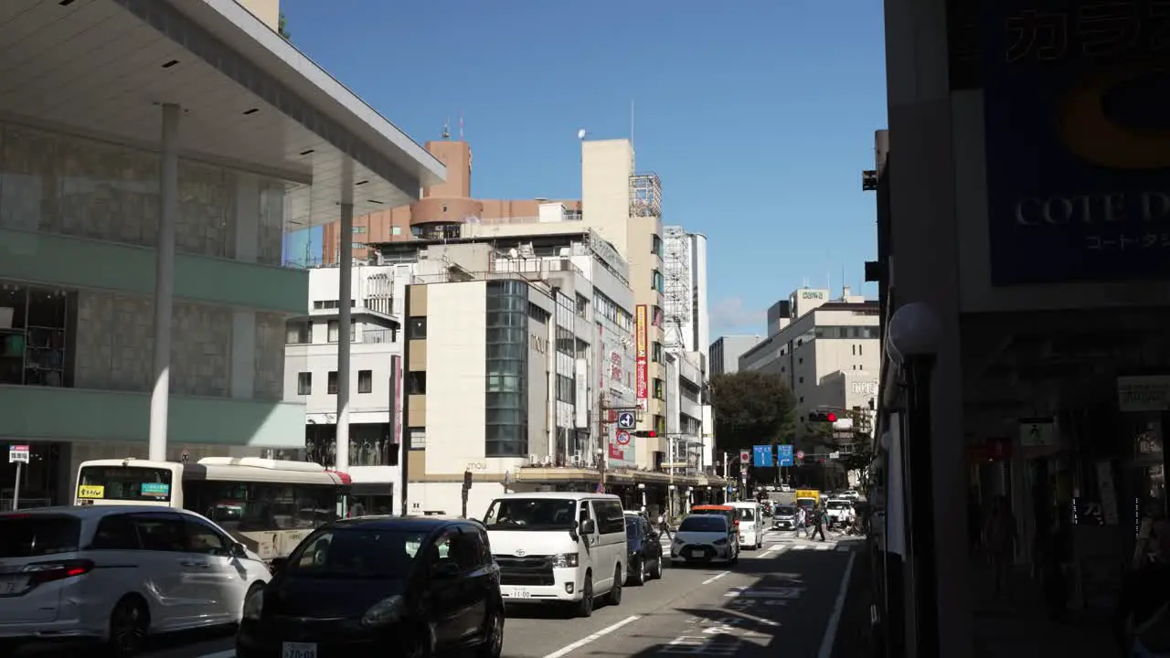 Line Of Traffic Along Hyakumangoku Dori Avenue In Kanazawa On Sunny October Afternoon