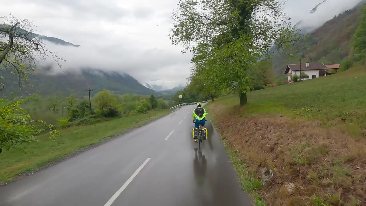 Cycling across Slovenia on a wet surface in wet weather travelling by bike