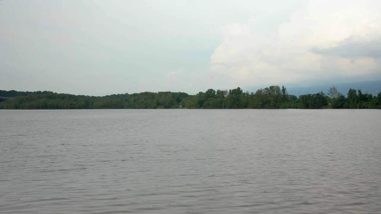 A stationary and peaceful view of a midwestern urban lake