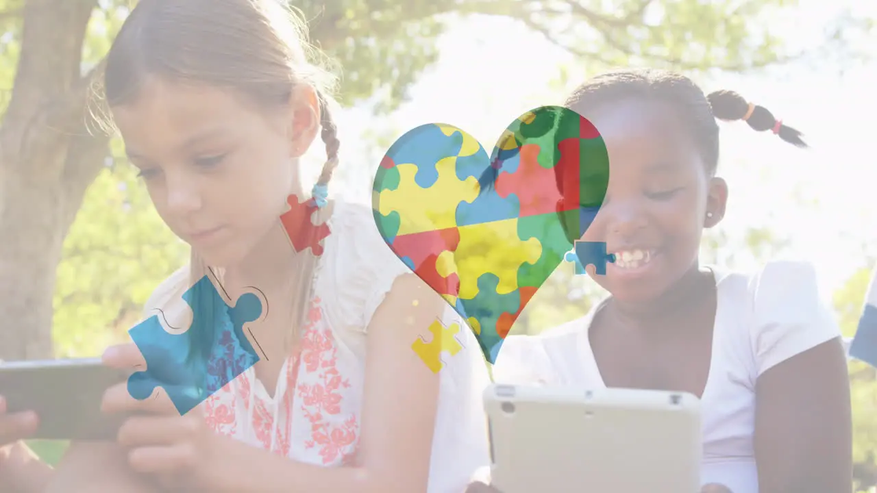 Caucasian girl and African American girl enjoy technology outdoors