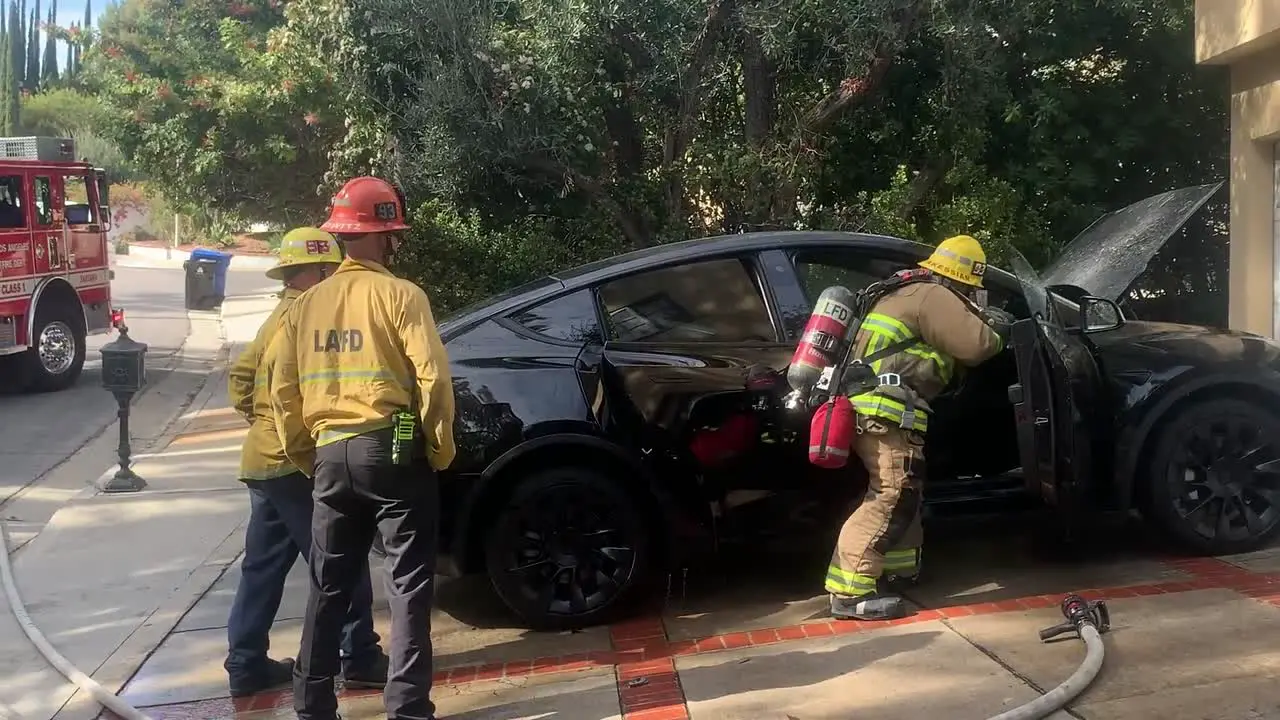 firefighters open Tesla to extinguish fire