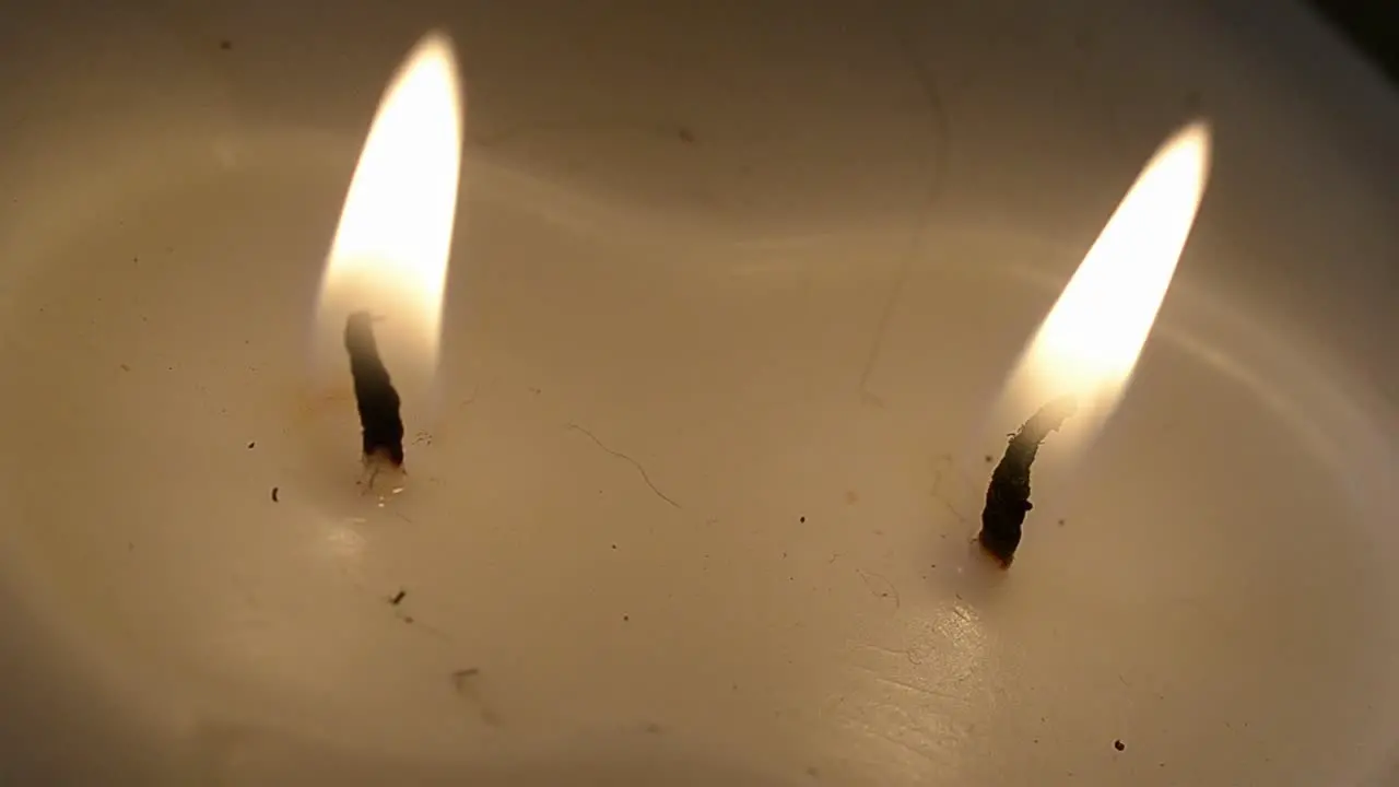 Lighting a candle with a match