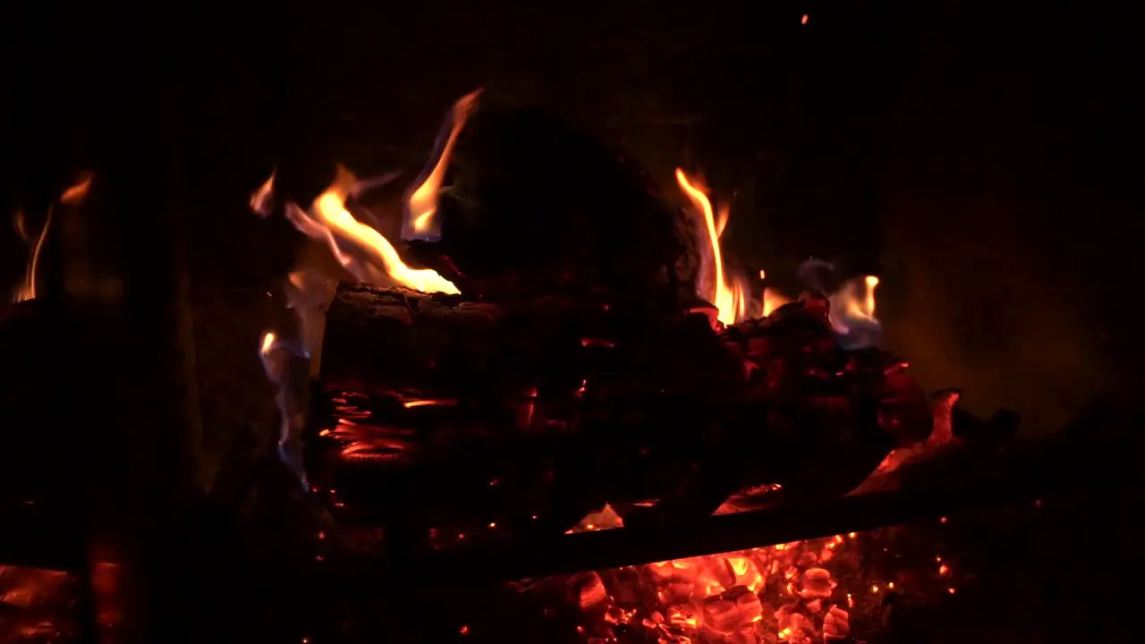 Sparks Fly off of Red Hot Glowing Fire in Slow Motion