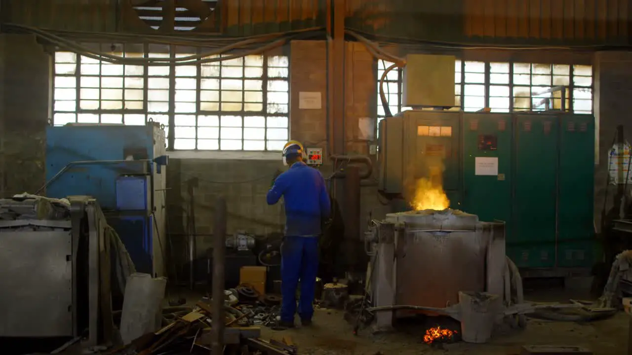 Worker working in foundry workshop 4k