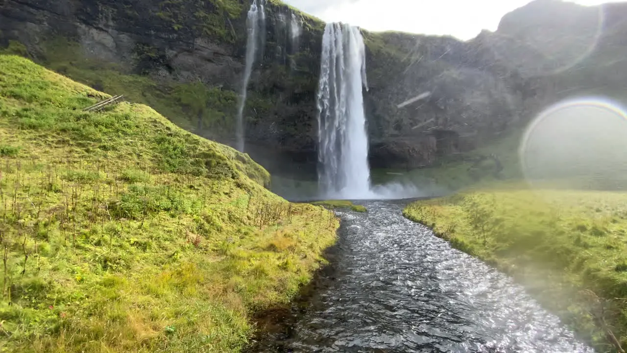 Seljalandsfoss in Iceland with a stream