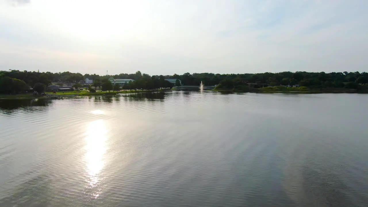 Flying over a boat in a beautiful Central Florida lake during sunset