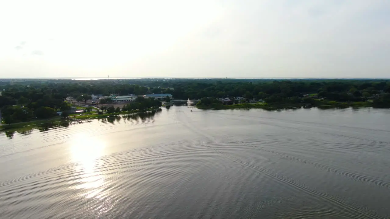 Evening Flight over Lake Ocoee in Central Florida featuring boats a fountain and an early sunset