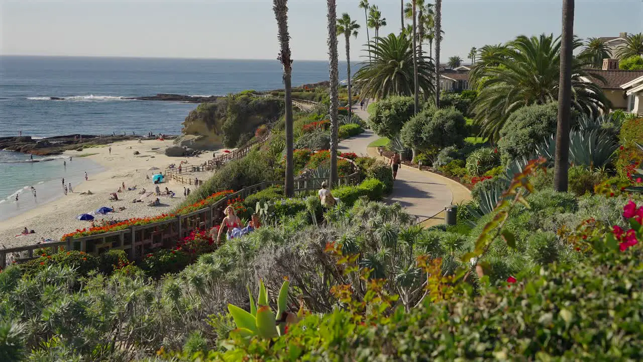 Girls walking along a path above treasure island beach Laguna Beach California