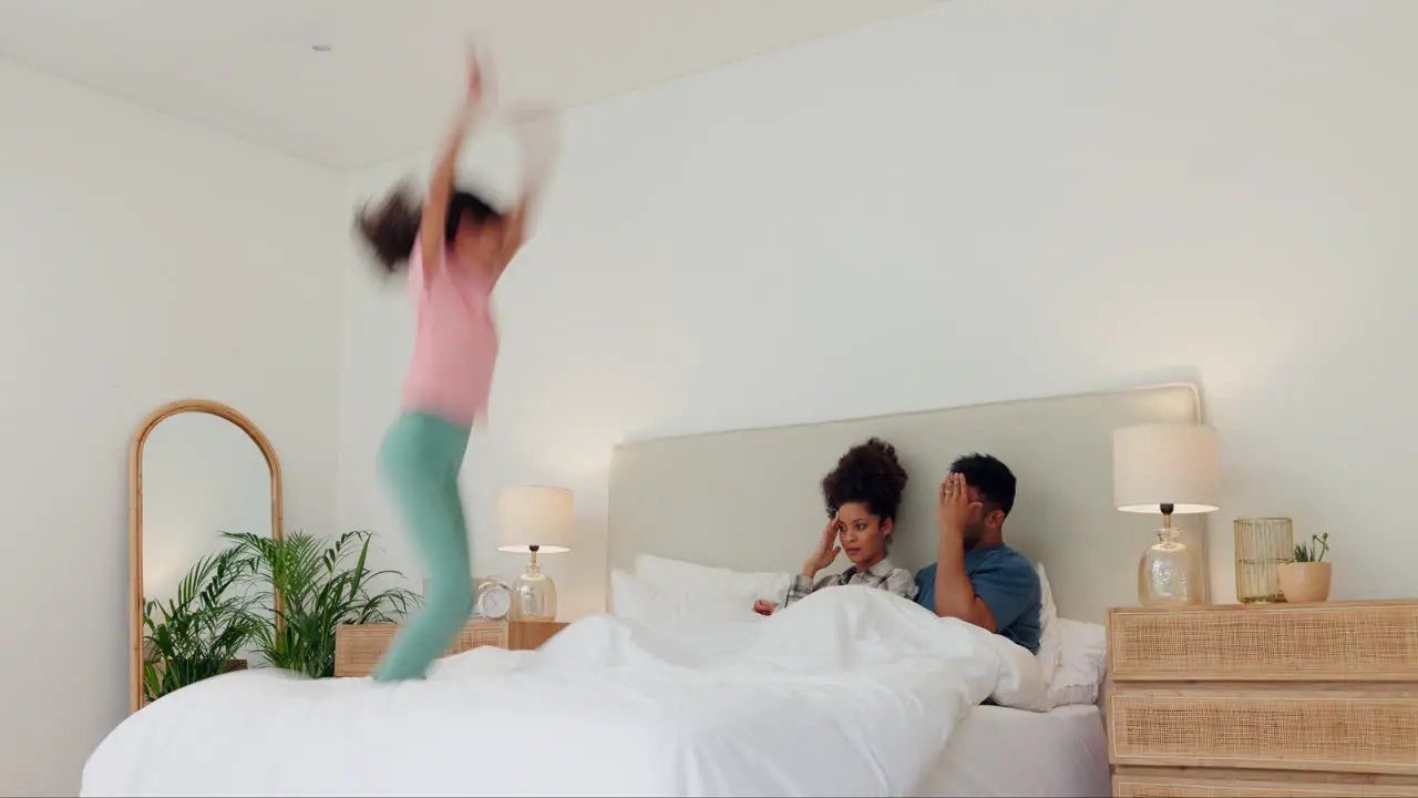 Parents jump and girl with stress