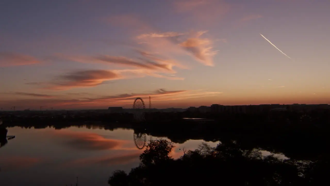 Morning sunrise over the city lake orange