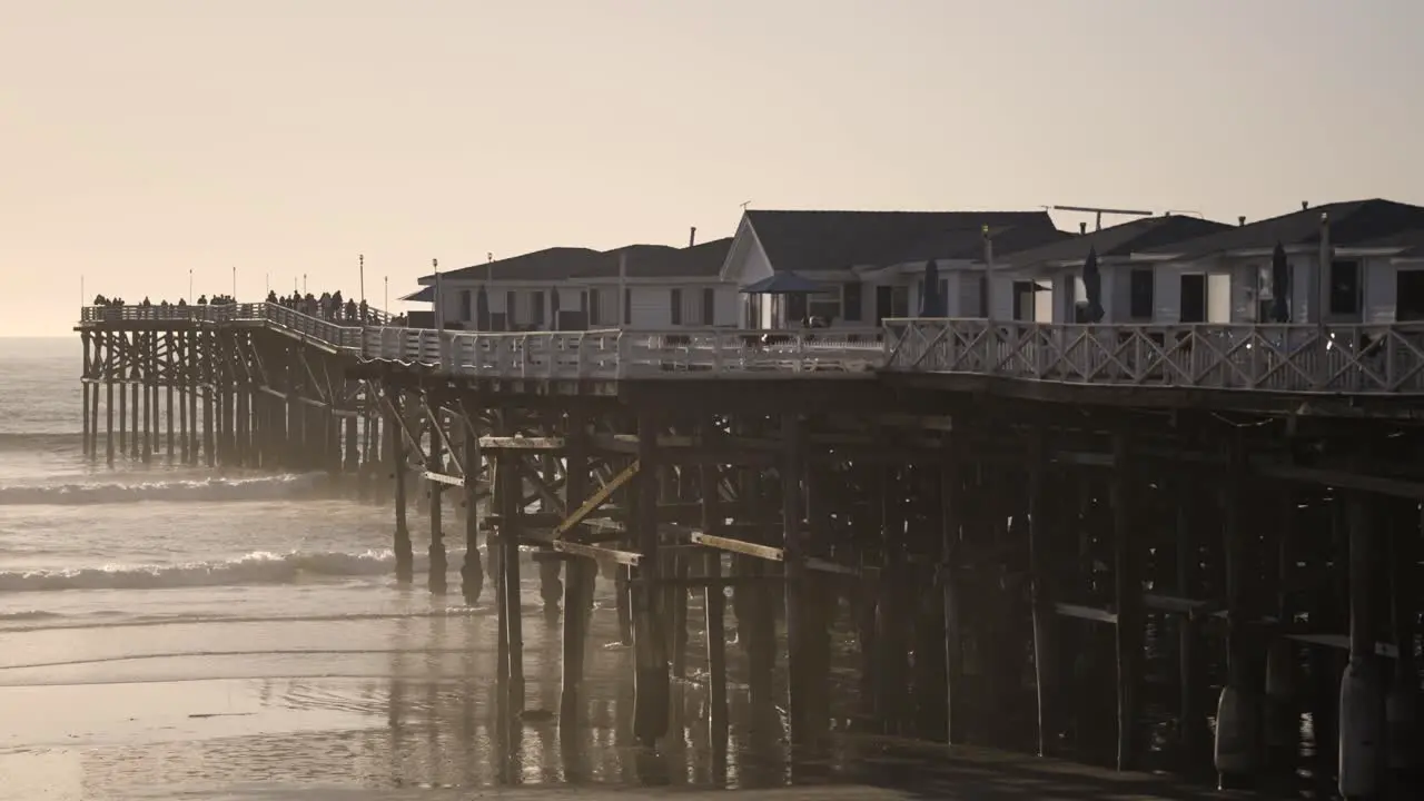 Pacific Beach California Sunset with Waves Crashing on Beach Slow Motion left side of pier